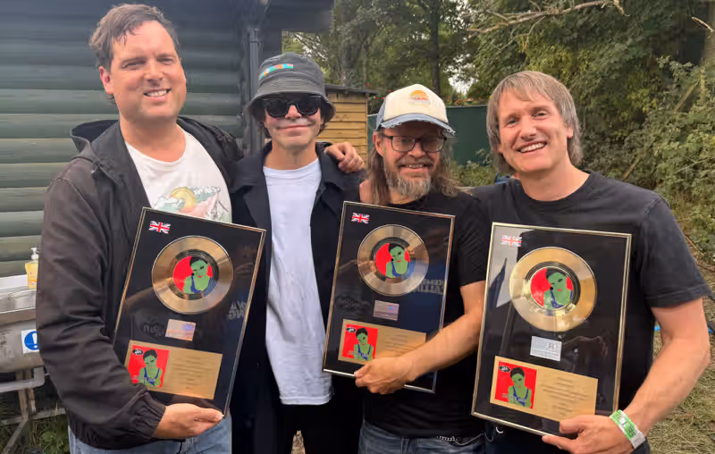 Ash surprise fans at Kendal Calling by performing as tribute band before being presented with gold discs for ‘Girl From Mars’