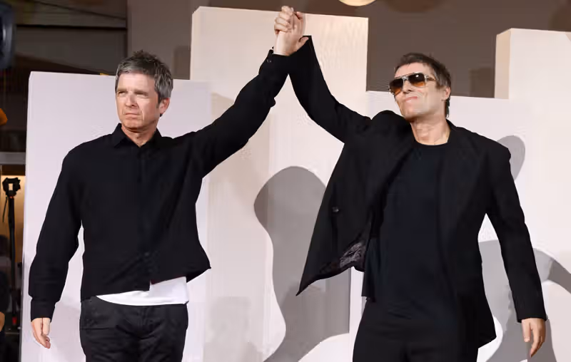 Watch Noel and Liam Gallagher react to ‘Oasis: Don’t Look Back In Anger’ doc getting eight minute standing ovation at Venice Film Festival