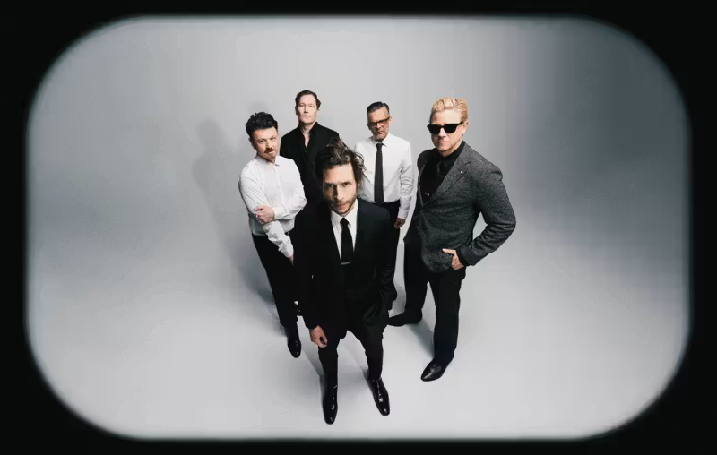 Interpol stare down AI on atmospheric new single ‘Iron City’